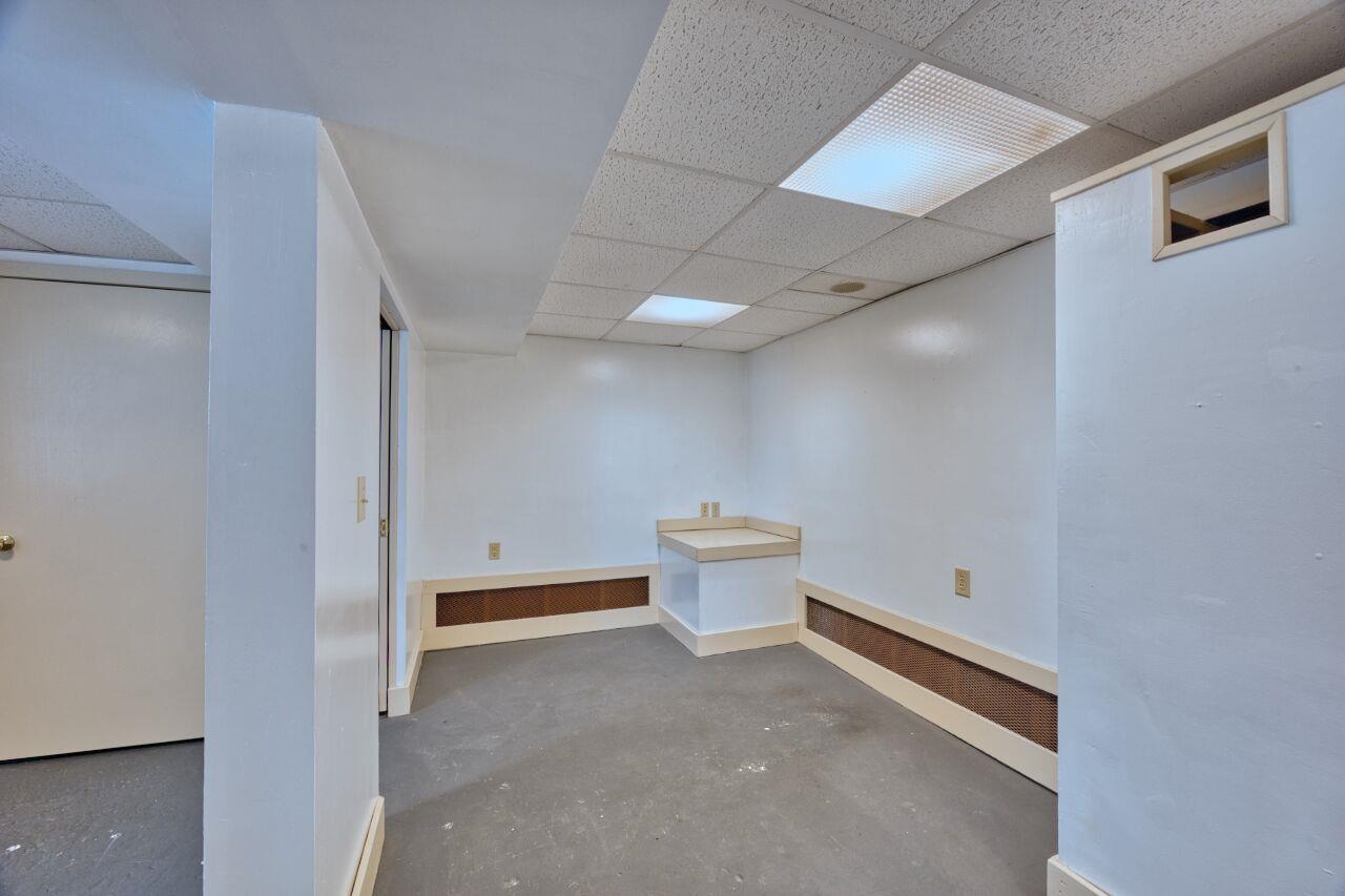 4191 Kerr Location Hibbing, MN 55746 - Photo 17 of 37 Finished below grade area featuring a drop ceiling and baseboards