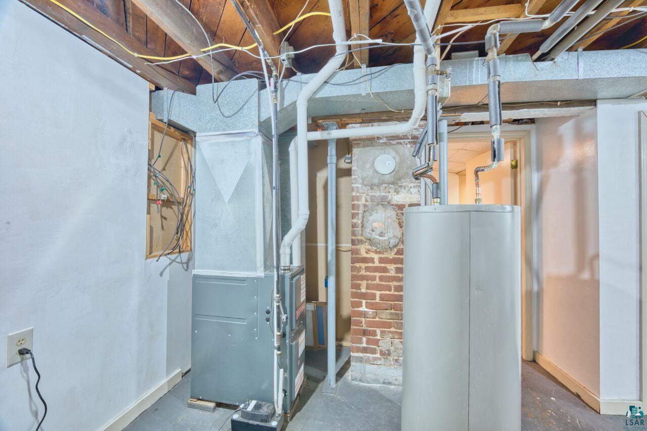 4191 Kerr Location Hibbing, MN 55746 - Photo 21 of 37 Utility room with water heater and heating unit
