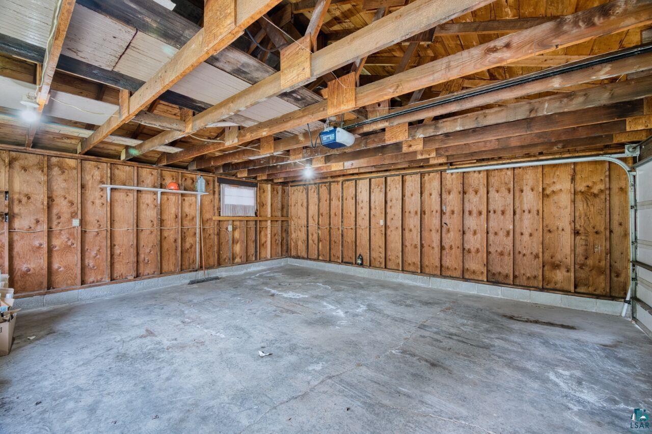 4191 Kerr Location Hibbing, MN 55746 - Photo 24 of 37 Garage featuring a garage door opener