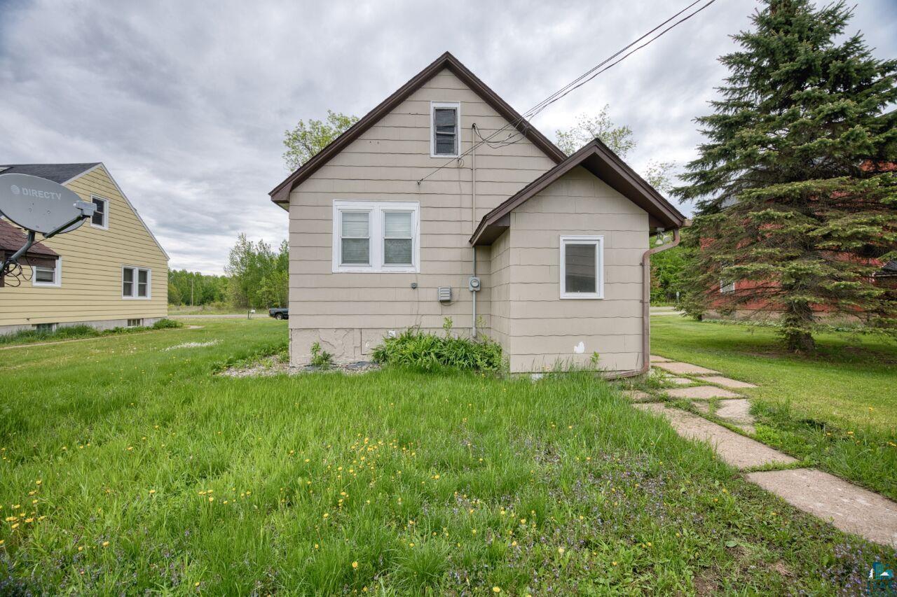 4191 Kerr Location Hibbing, MN 55746 - Photo 27 of 37 Back of property featuring a lawn