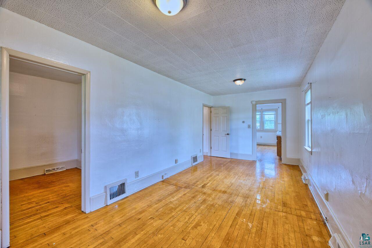 4191 Kerr Location Hibbing, MN 55746 - Photo 3 of 37 Empty room with light wood finished floors
