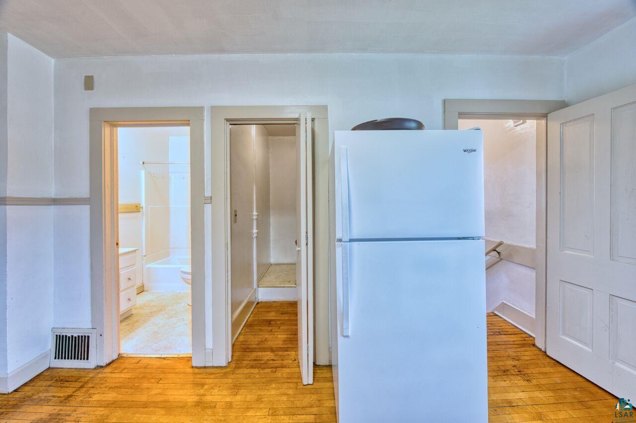 4191 Kerr Location Hibbing, MN 55746 - Photo 8 of 37 Kitchen featuring freestanding refrigerator and light wood-type flooring