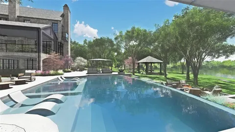 a view of a chair and table in backyard of the house