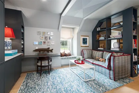 a living room with furniture and window