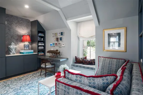 a view of living room with furniture and fireplace