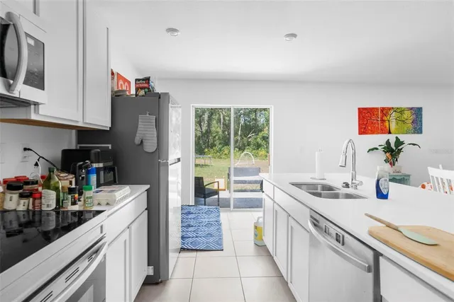 a kitchen that has a lot of cabinets in it