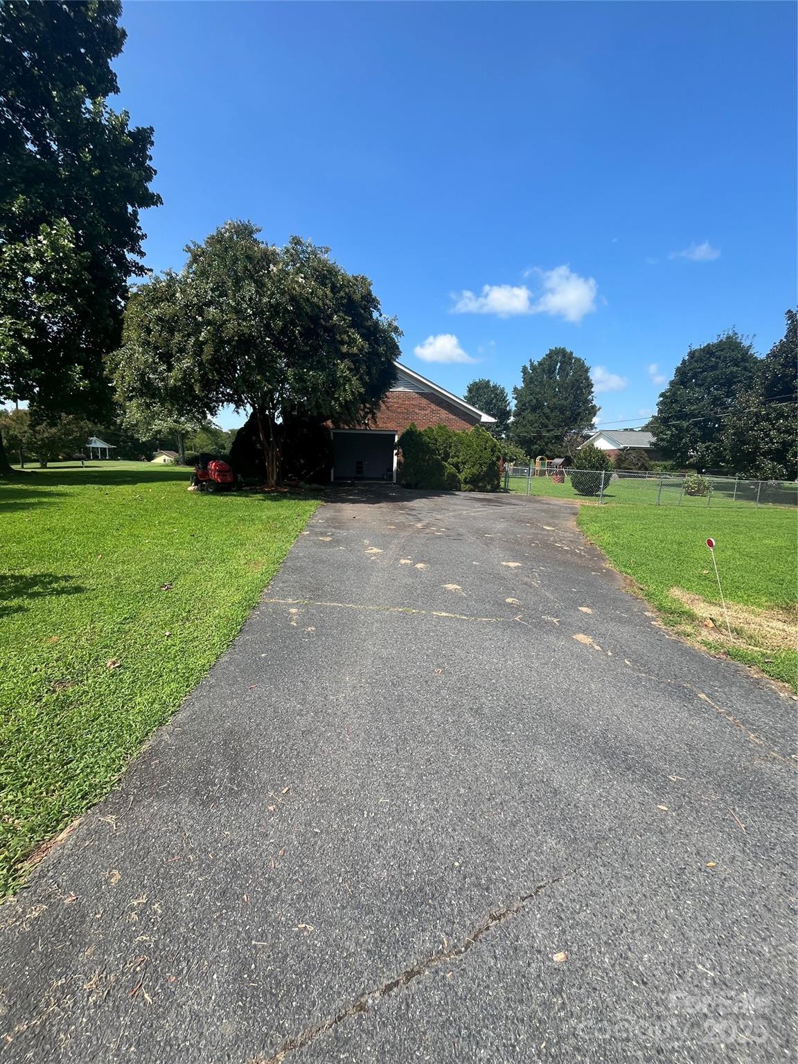 35209 Beth Road Albemarle, NC 28001 - Photo 12 of 38 a view of a yard with palm tree