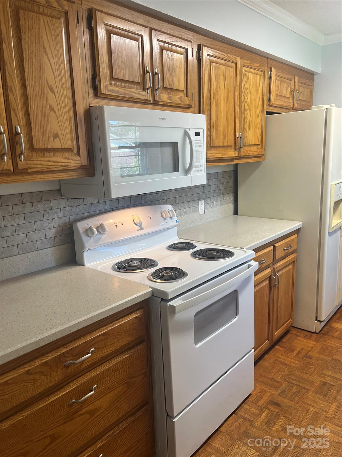 35209 Beth Road Albemarle, NC 28001 - Photo 25 of 38 a kitchen with granite countertop cabinets stainless steel appliances and a counter space