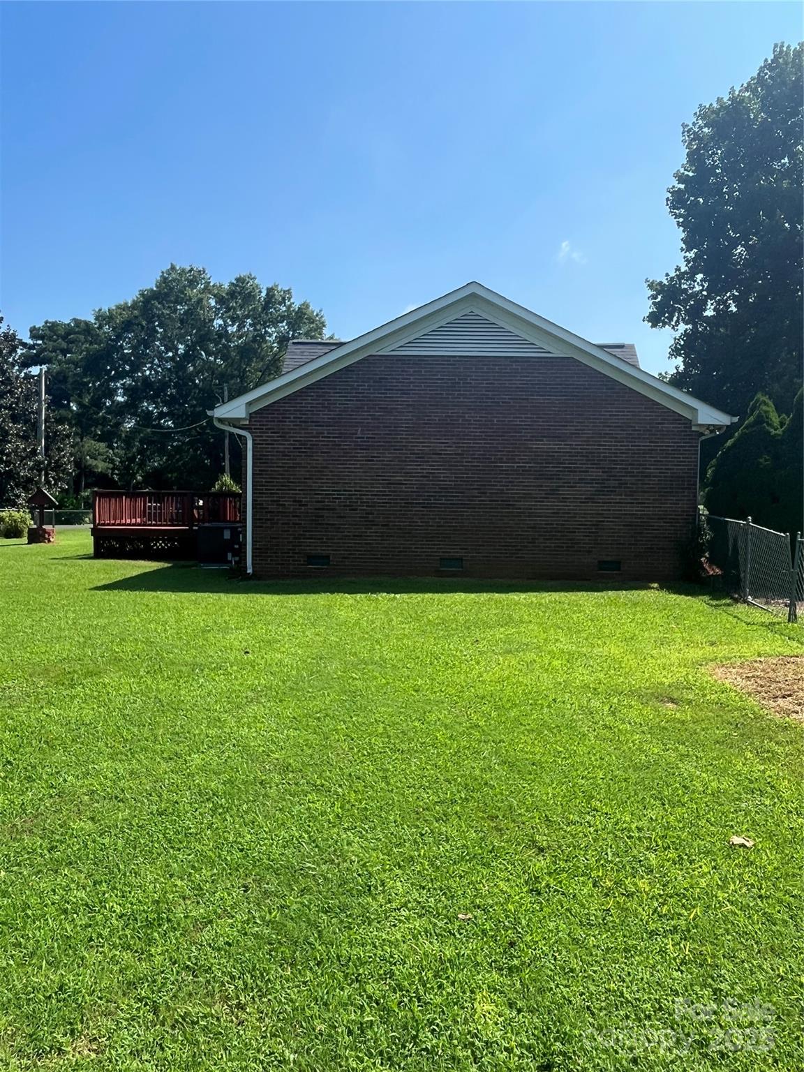 35209 Beth Road Albemarle, NC 28001 - Photo 3 of 38 a backyard of a house with lots of green space
