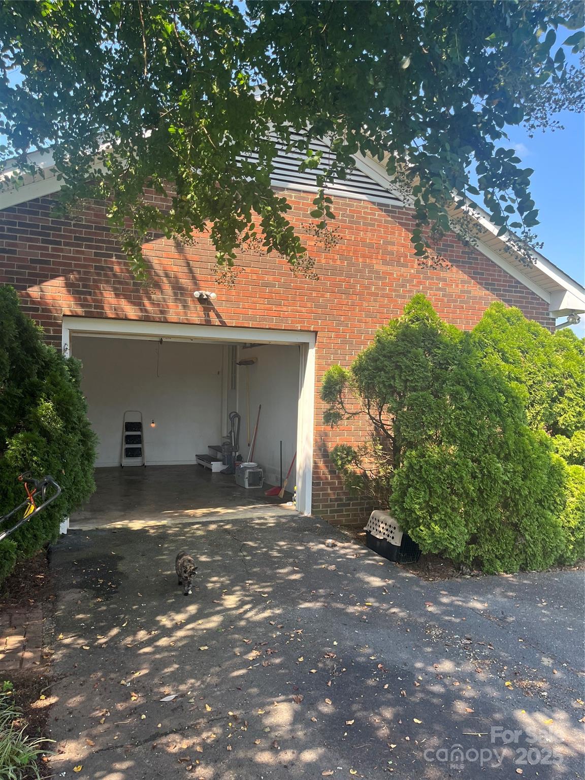 35209 Beth Road Albemarle, NC 28001 - Photo 6 of 38 a front view of a house with a yard and garage