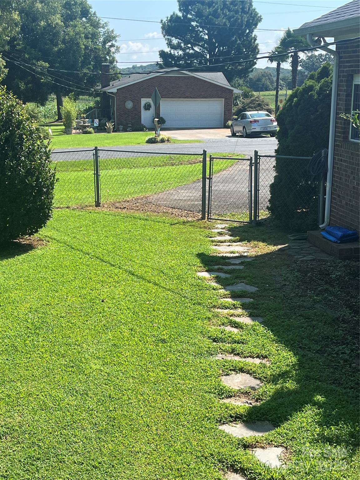 35209 Beth Road Albemarle, NC 28001 - Photo 8 of 38 a view of a park with swings and a lake view