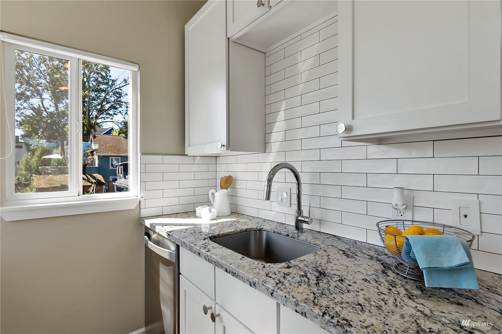 1724 26th Avenue Seattle, WA 98122 - Photo 16 of 37 a kitchen with a sink and a window