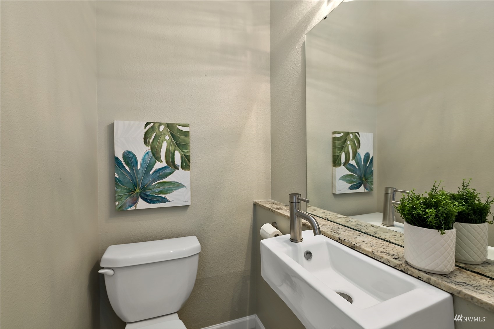 1724 26th Avenue Seattle, WA 98122 - Photo 21 of 37 a bathroom with a toilet a sink and mirror