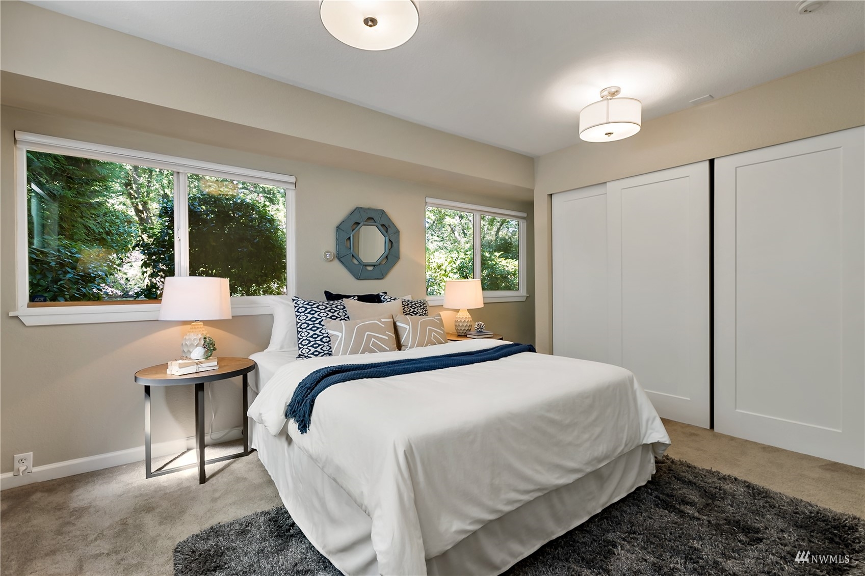 1724 26th Avenue Seattle, WA 98122 - Photo 23 of 37 a bedroom with a bed and large windows