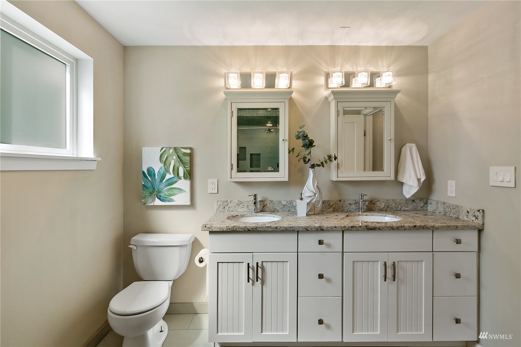 1724 26th Avenue Seattle, WA 98122 - Photo 25 of 37 a bathroom with a granite countertop toilet sink and mirror