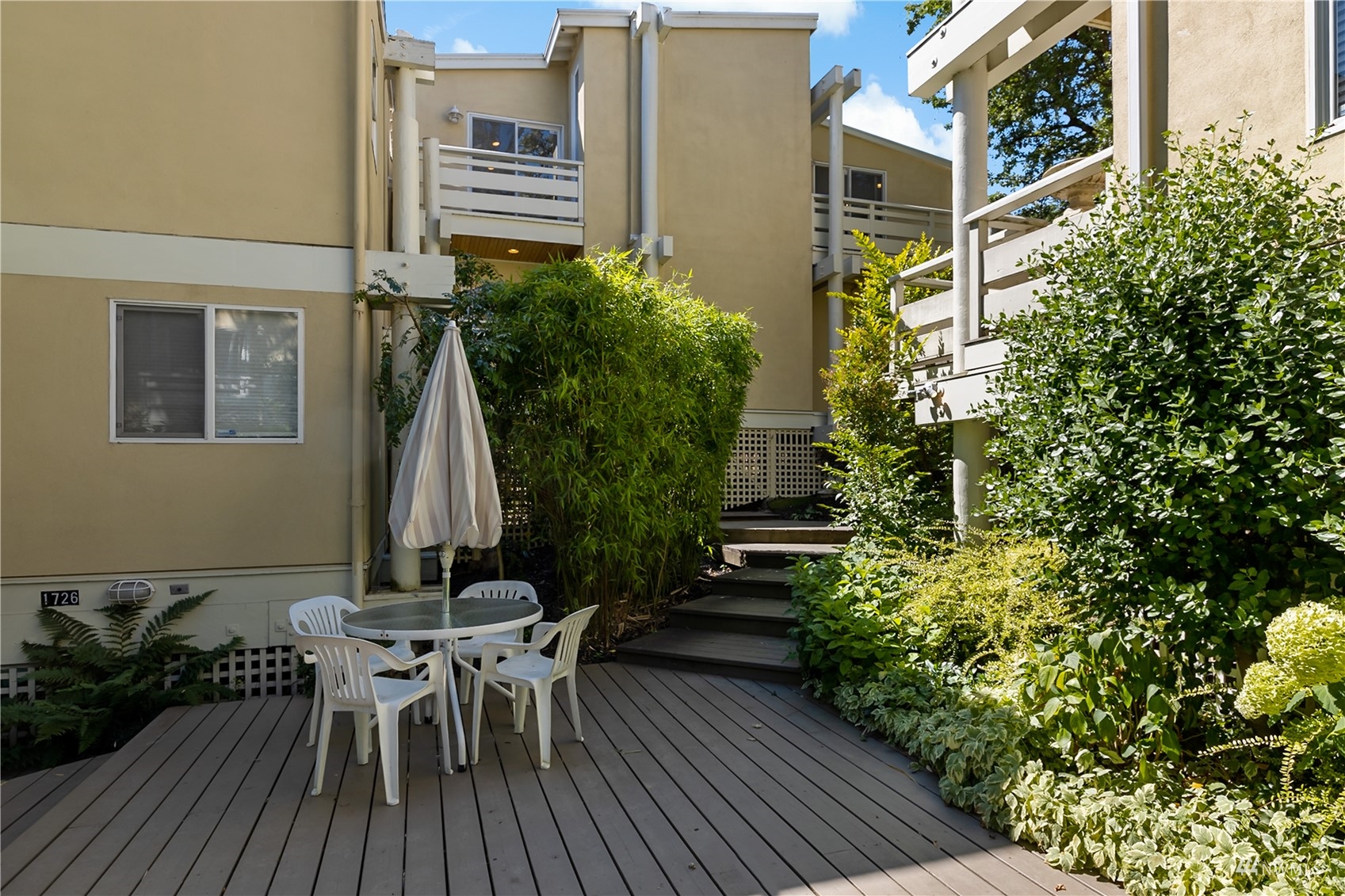 1724 26th Avenue Seattle, WA 98122 - Photo 30 of 37 a view of a dinning table and chairs in patio of the house