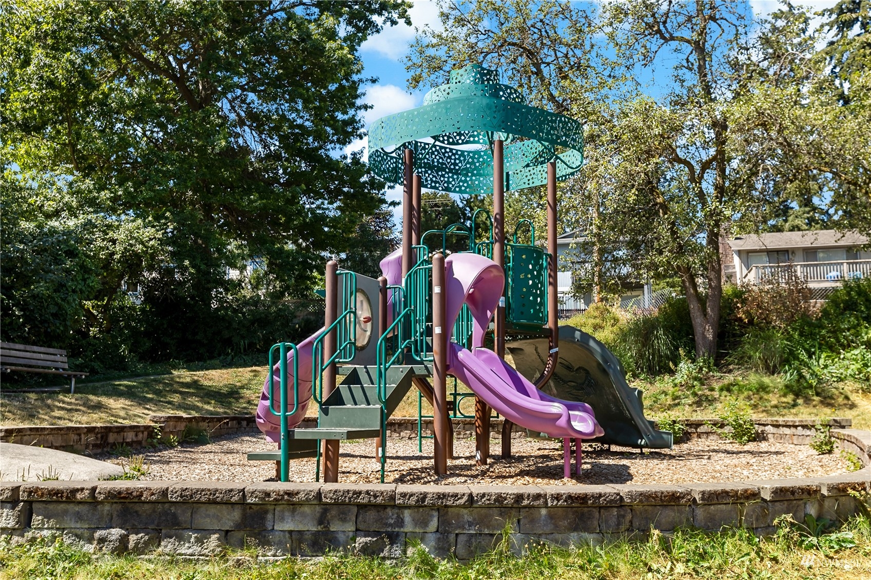 1724 26th Avenue Seattle, WA 98122 - Photo 35 of 37 a small garden with trees in the background