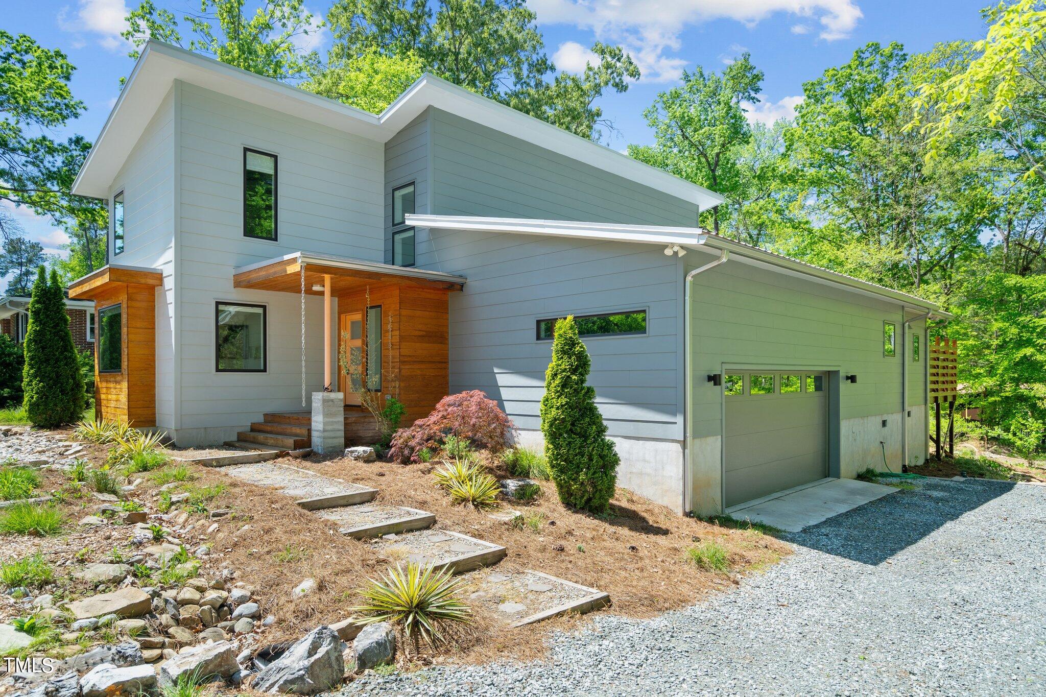 3546 Dixon Road Durham, NC 27707 - Photo 2 of 16 Beautiful modern architecture with side load garage.