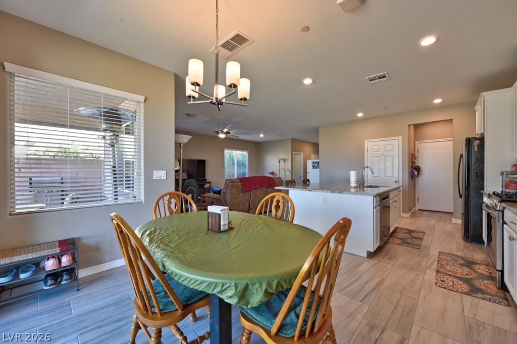 1054 Langston Ranch Avenue Henderson, NV 89002 - Photo 23 of 82 Dining area with a big picture window.