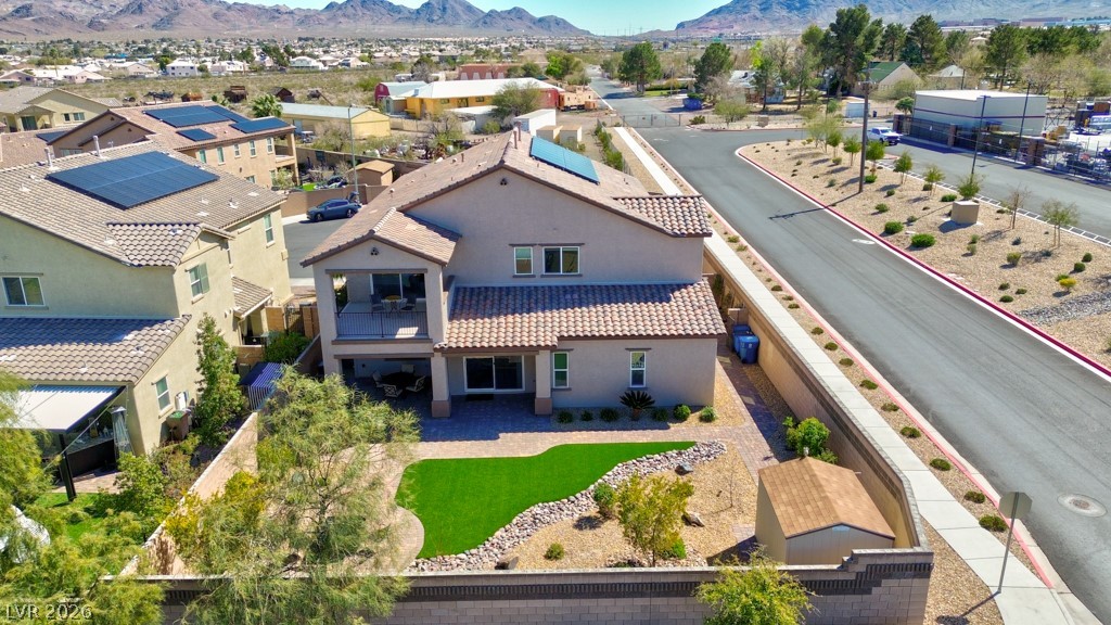 1054 Langston Ranch Avenue Henderson, NV 89002 - Photo 3 of 82 Aerial perspective of suburban area featuring a mountain backdrop
