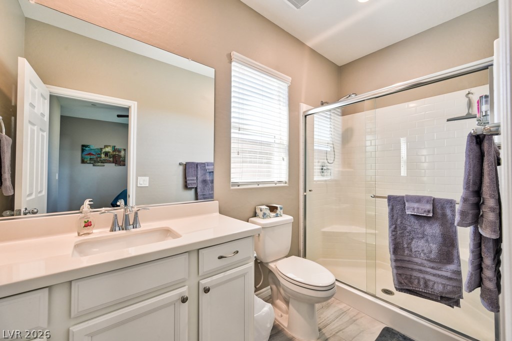 1054 Langston Ranch Avenue Henderson, NV 89002 - Photo 33 of 82 Casita bathroom featuring vanity and a walk in shower