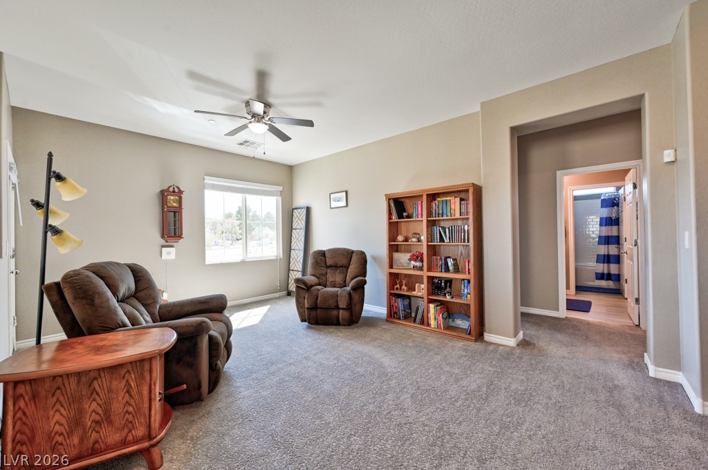 1054 Langston Ranch Avenue Henderson, NV 89002 - Photo 34 of 82 Huge Loft, gaming room, Sitting room or flex space. Featuring lighted ceiling fan and carpet floors. HARD WIRED INTERNET PORT AND EXTRA PHONE JACK. Window looks out to south and mountain views. Hall leads to 3 additional bedrooms and full bathroom.