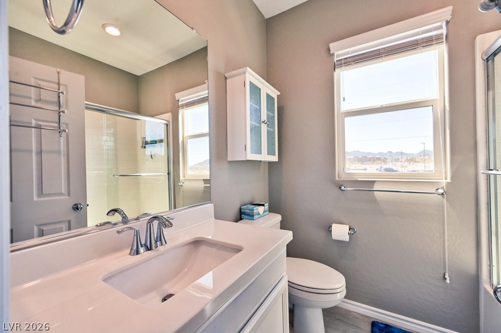 1054 Langston Ranch Avenue Henderson, NV 89002 - Photo 50 of 82 PRIMARY Bathroom TO DUAL PRIMARY BEDROOM 4 featuring vanity and an enclosed shower/tub combination.