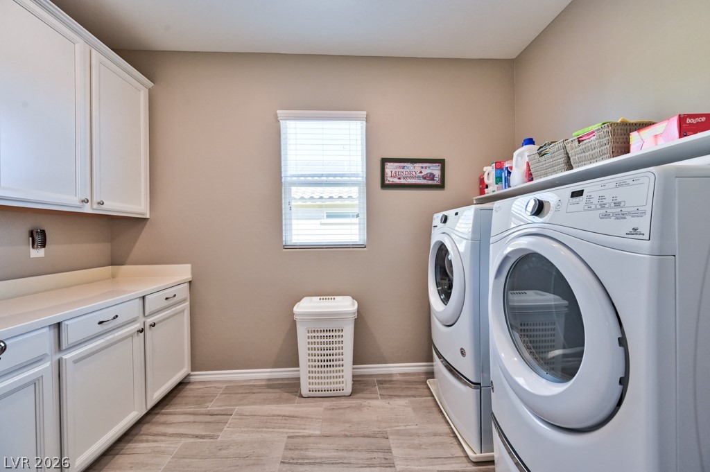 1054 Langston Ranch Avenue Henderson, NV 89002 - Photo 51 of 82 Laundry room with washer and clothes dryer included. Lots of Counter and cabinet space. There is a main hub for the electrical components in this room.