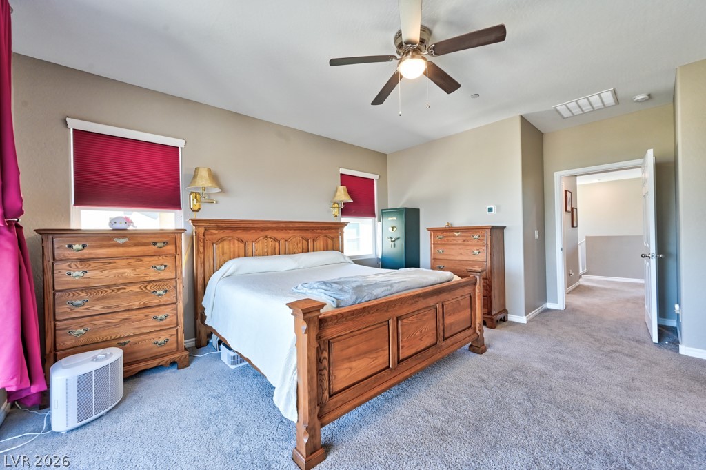 1054 Langston Ranch Avenue Henderson, NV 89002 - Photo 53 of 82 Bedroom with light carpet and a ceiling fan