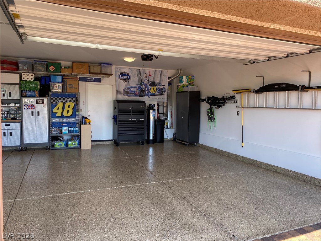1054 Langston Ranch Avenue Henderson, NV 89002 - Photo 63 of 82 Finished garage with painted walls and ceiling. Water conditioner included. Detached storage units are not included.