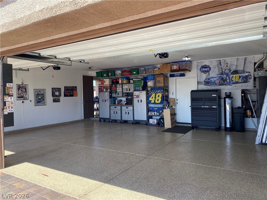 1054 Langston Ranch Avenue Henderson, NV 89002 - Photo 65 of 82 Garage featuring water heater and baseboards