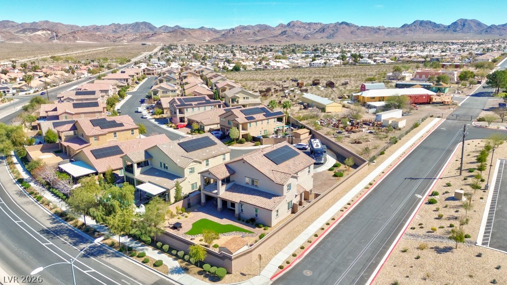 1054 Langston Ranch Avenue Henderson, NV 89002 - Photo 74 of 82 Aerial view of property and surrounding area featuring mountains and nearby suburban area