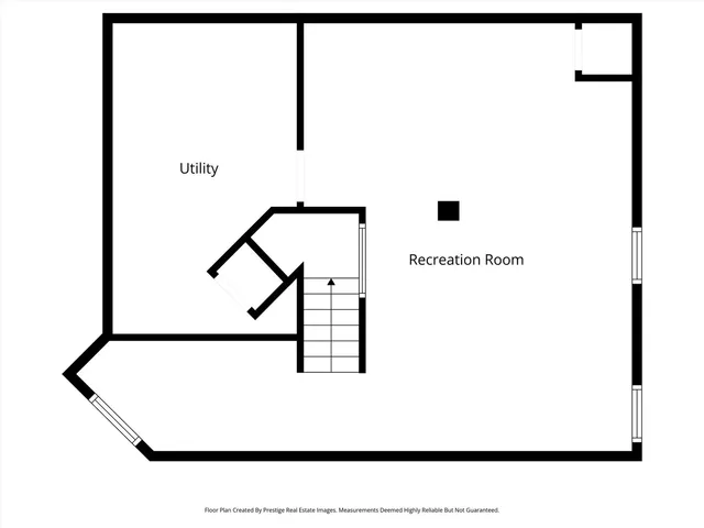 a picture of a room with a white wall and a potted plant