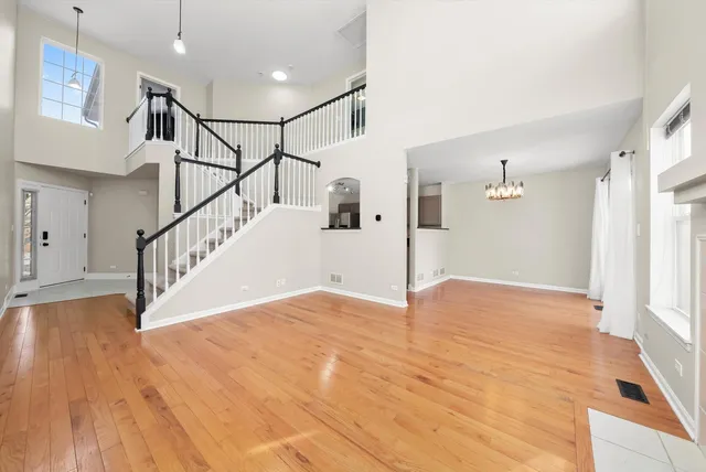a view of an entryway with wooden floor