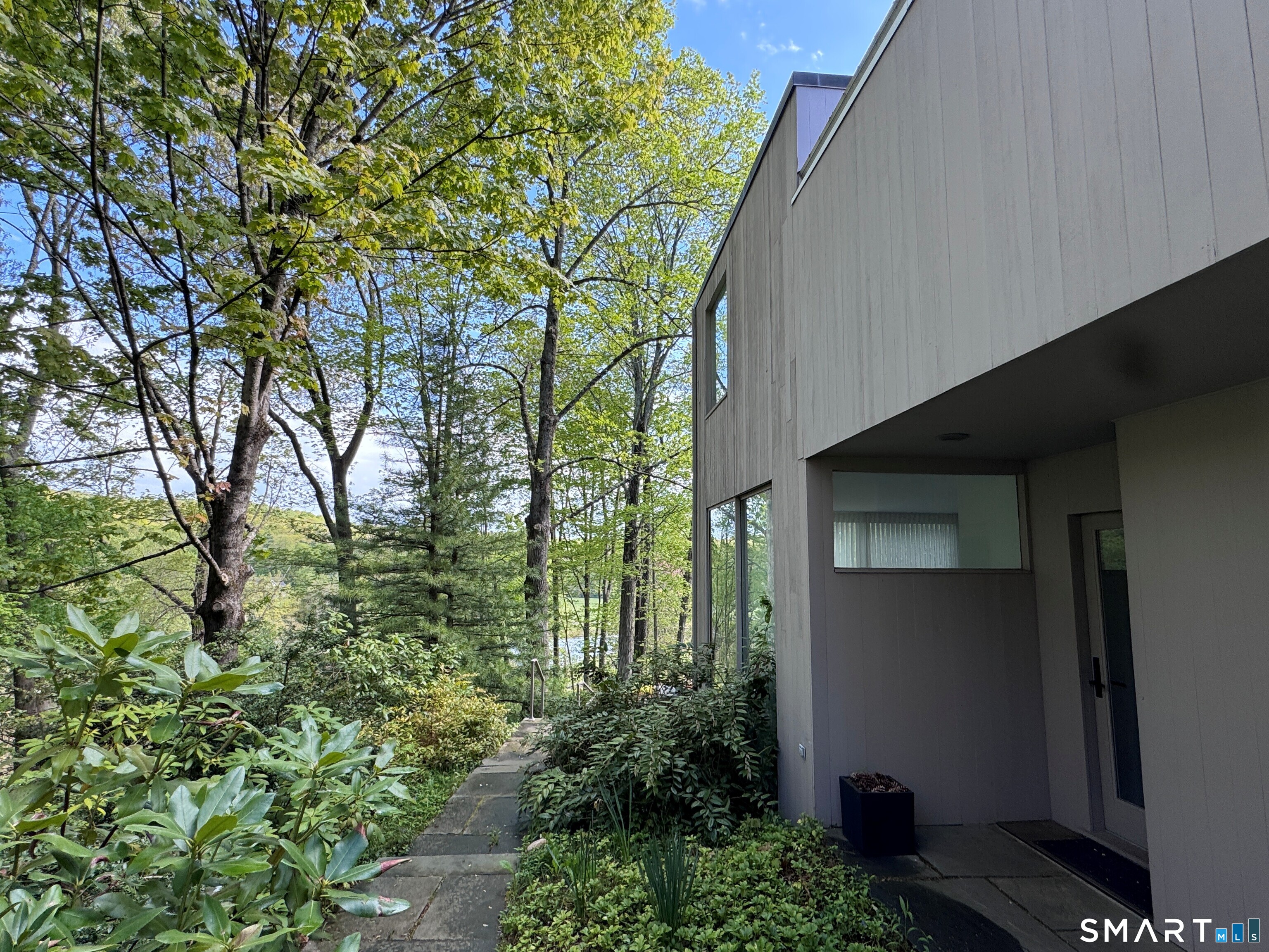 370 R Maiden Lane Durham, CT 06422 - Photo 3 of 28 Modern architecture tucked quietly into the trees... where every path feels like a walk through your own private retreat.