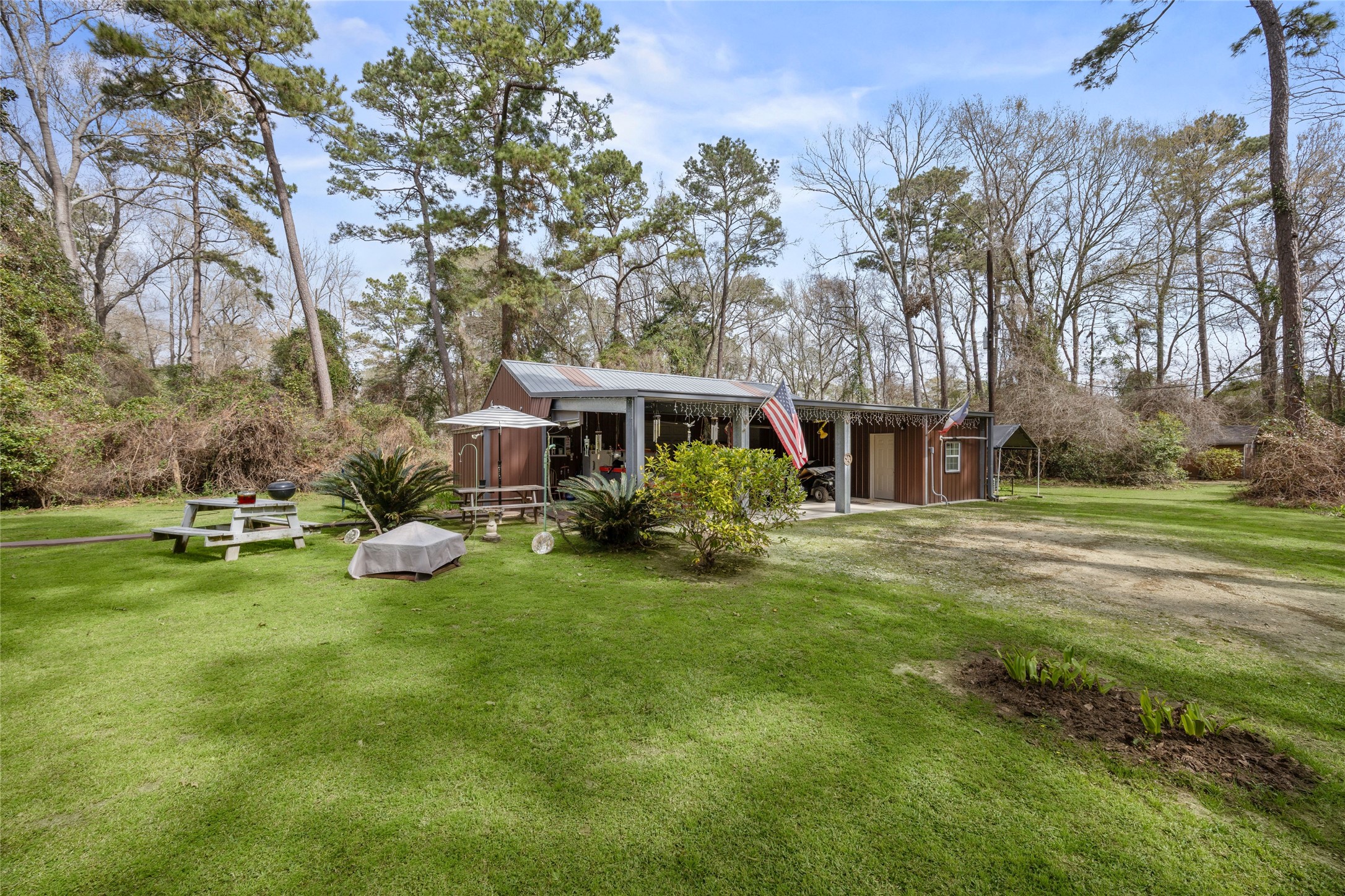 31601 Huffman Cleveland Road Huffman, TX 77336 - Photo 11 of 38 a view of a house with backyard porch and sitting area