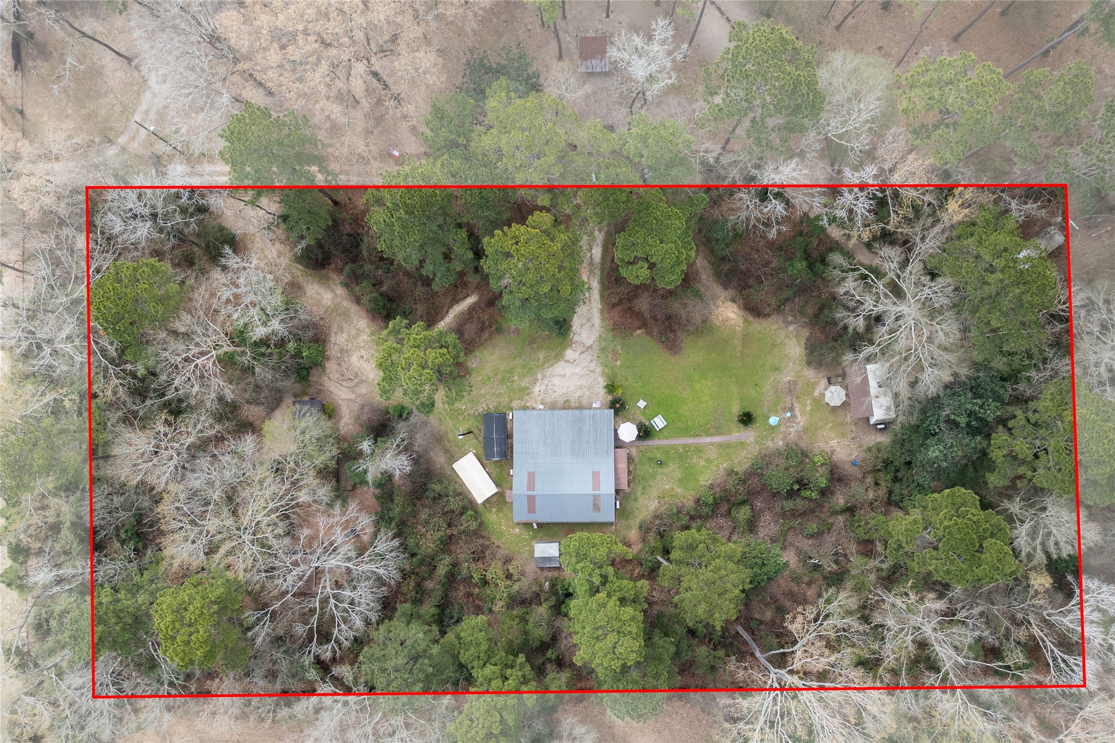 31601 Huffman Cleveland Road Huffman, TX 77336 - Photo 2 of 38 an aerial view of a house with a yard and lake view