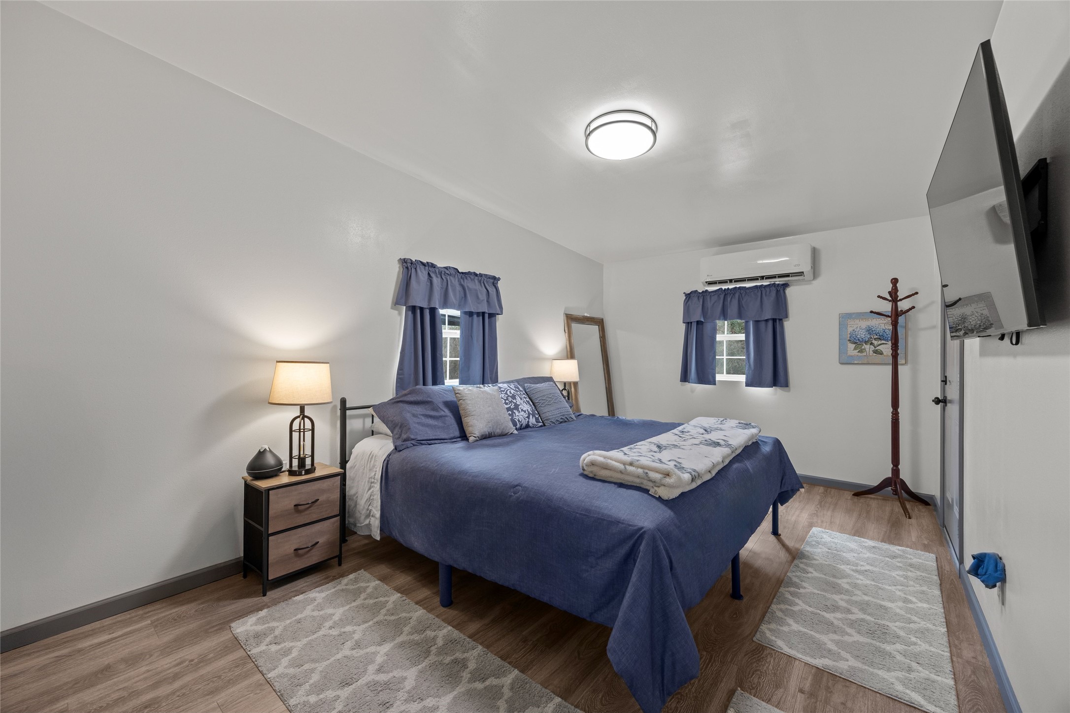 31601 Huffman Cleveland Road Huffman, TX 77336 - Photo 27 of 38 a bedroom with a bed and a tv