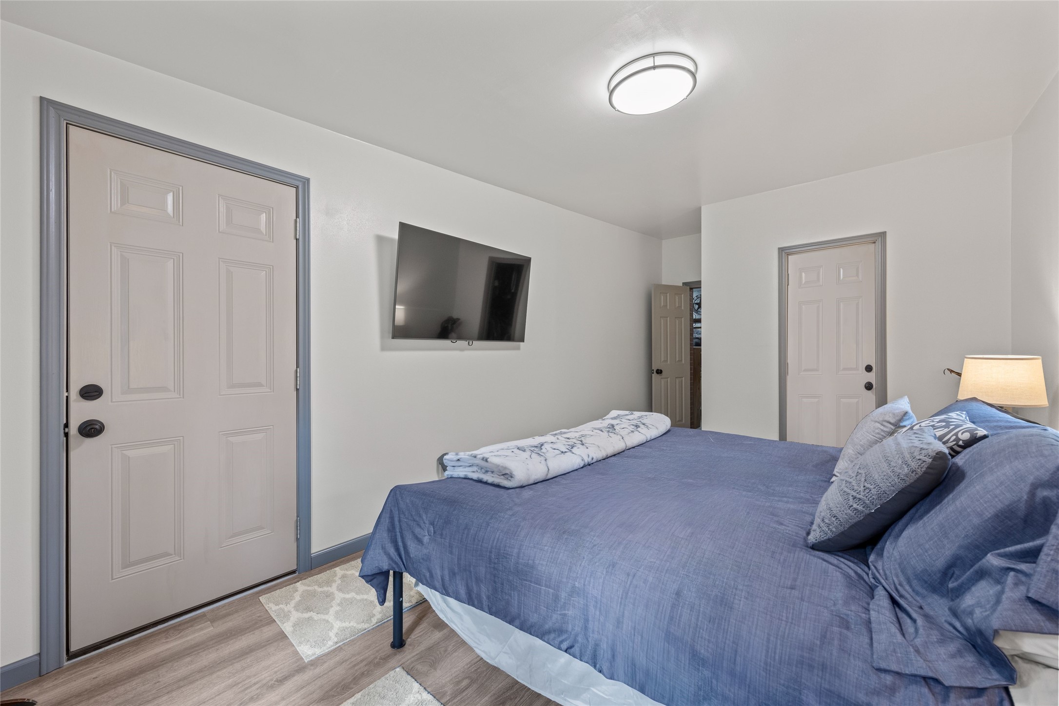 31601 Huffman Cleveland Road Huffman, TX 77336 - Photo 28 of 38 a bedroom with a bed and a flat tv screen on dresser