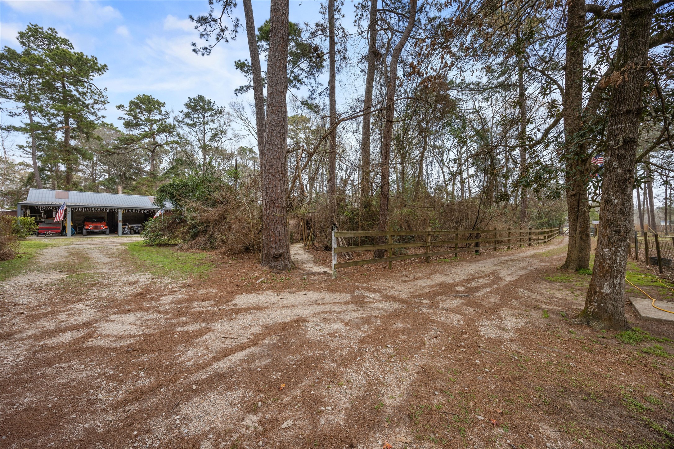 31601 Huffman Cleveland Road Huffman, TX 77336 - Photo 8 of 38 a backyard of a house with lots of green space