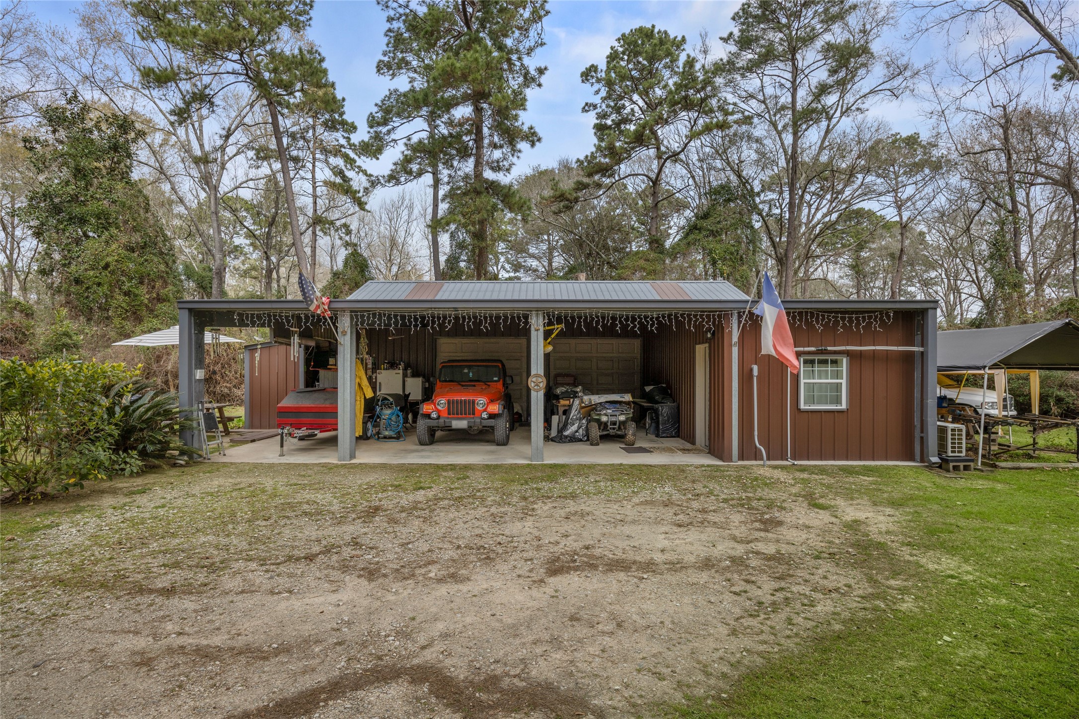 31601 Huffman Cleveland Road Huffman, TX 77336 - Photo 9 of 38 a view of a house with a large tree and a big yard