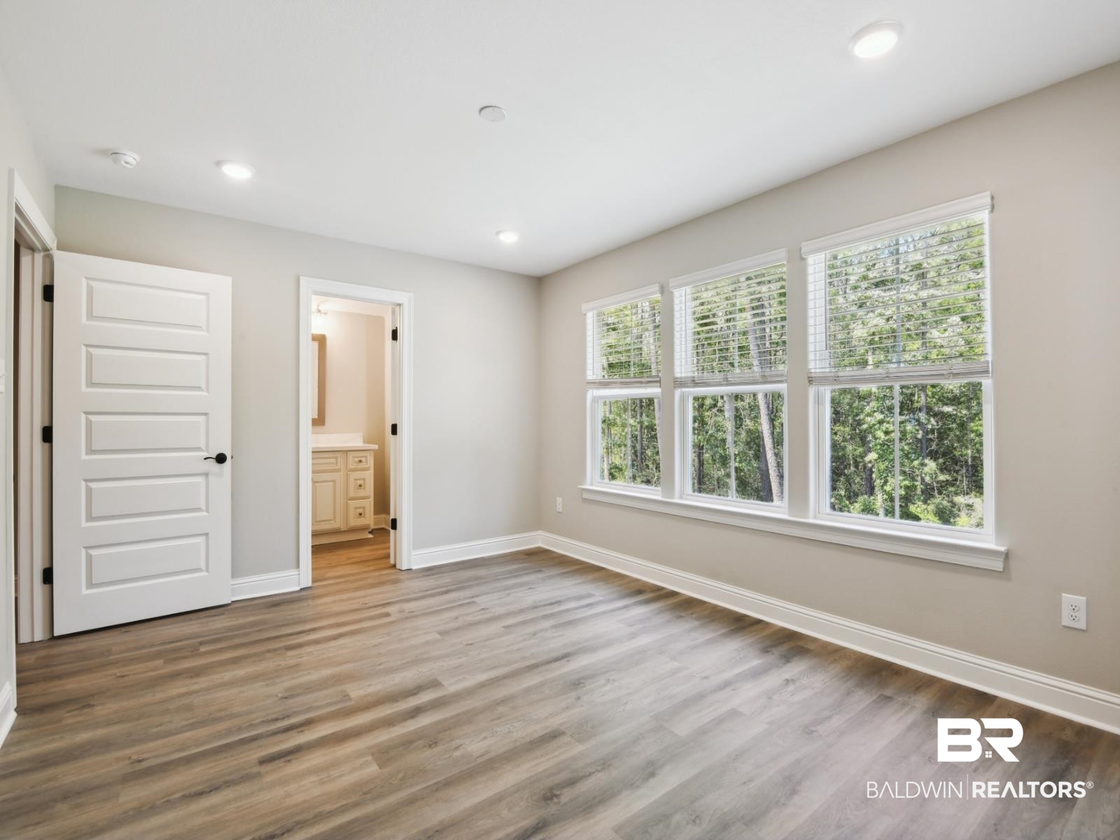 23937 Peppermint Street Elberta, AL 36530 - Photo 21 of 22 Unfurnished bedroom featuring recessed lighting, wood finished floors, and ensuite bath