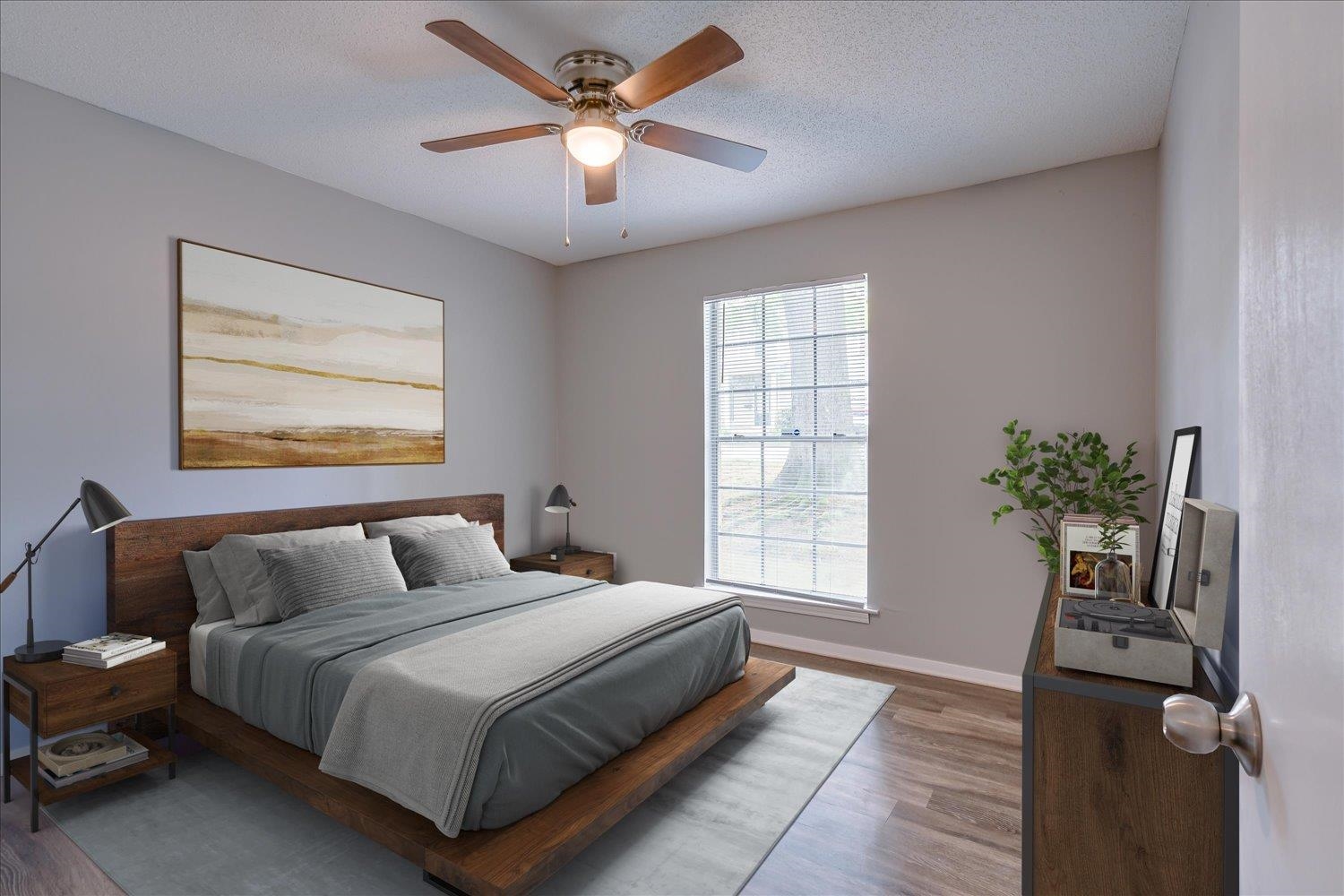 3636 Spottswood Avenue, Unit 1 Memphis, TN 38111 - Photo 24 of 32 a bedroom with a large bed and a chandelier