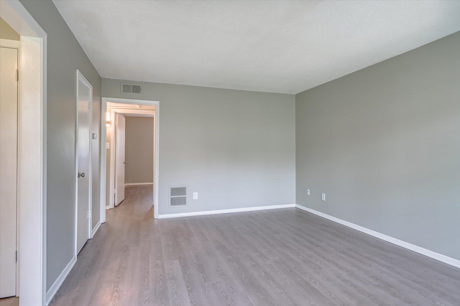 3636 Spottswood Avenue, Unit 1 Memphis, TN 38111 - Photo 10 of 32 a view of an empty room with wooden floor
