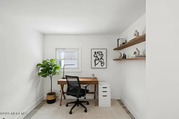 a bathroom with a sink toilet vanity and tub