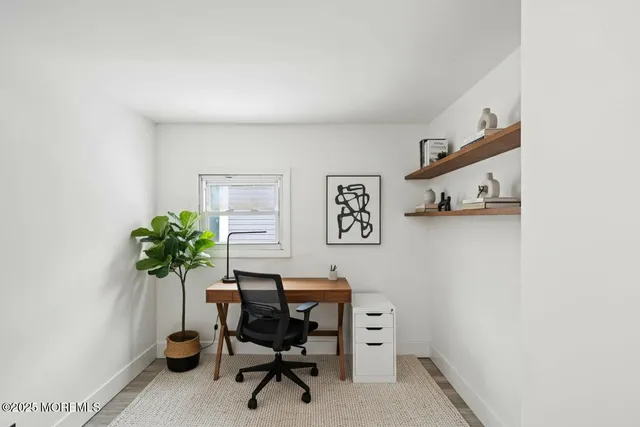 a bathroom with a sink toilet vanity and tub