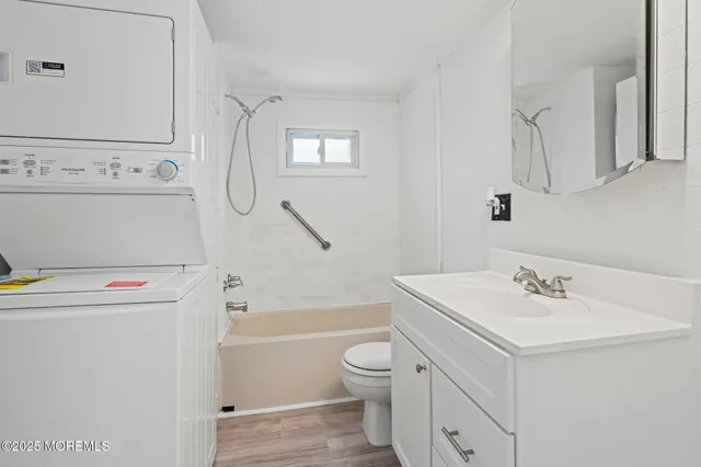 a view of a white house with a yard covered in snow