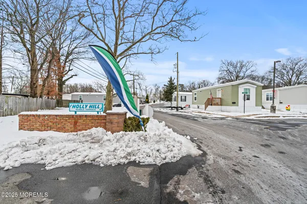 a view of a patio with a table and chairs and wooden floor