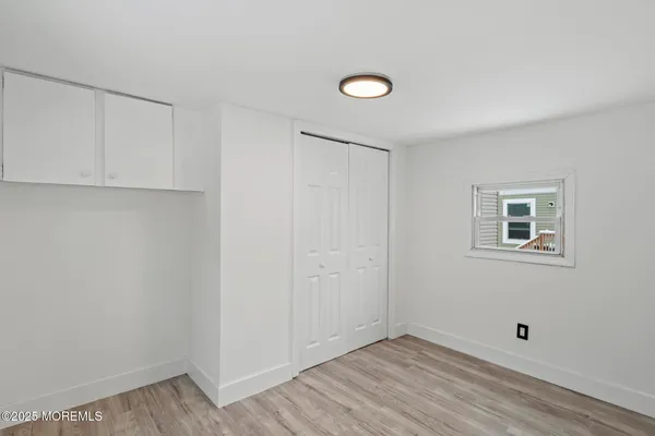 a view of a house with a wooden deck