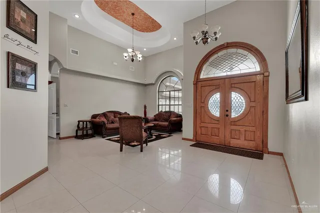 a living room with furniture and a large mirror